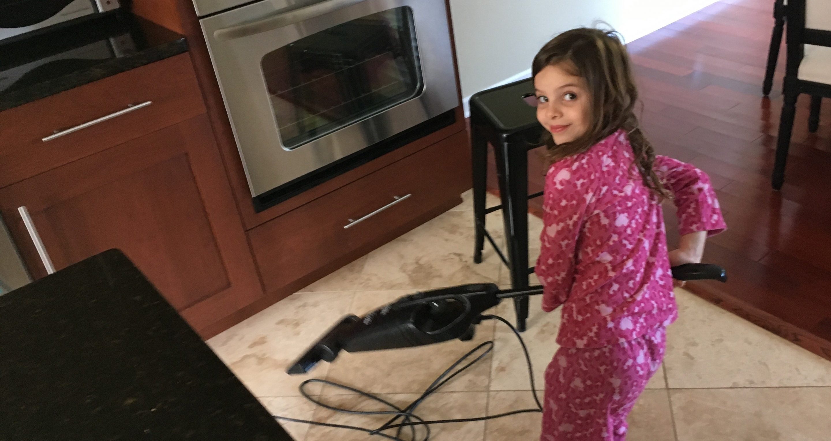 Zoey Vacuums the Kitchen