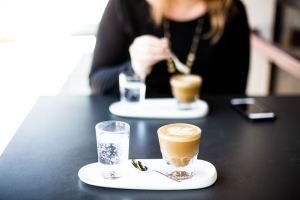 Woman drinking coffee in a cafe