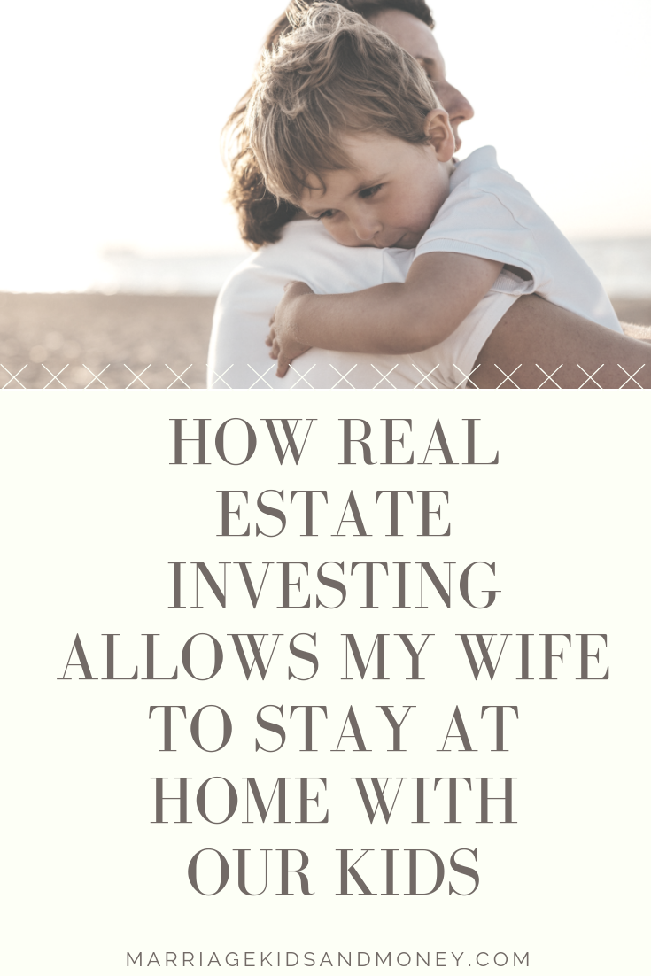 Parent holding child in field