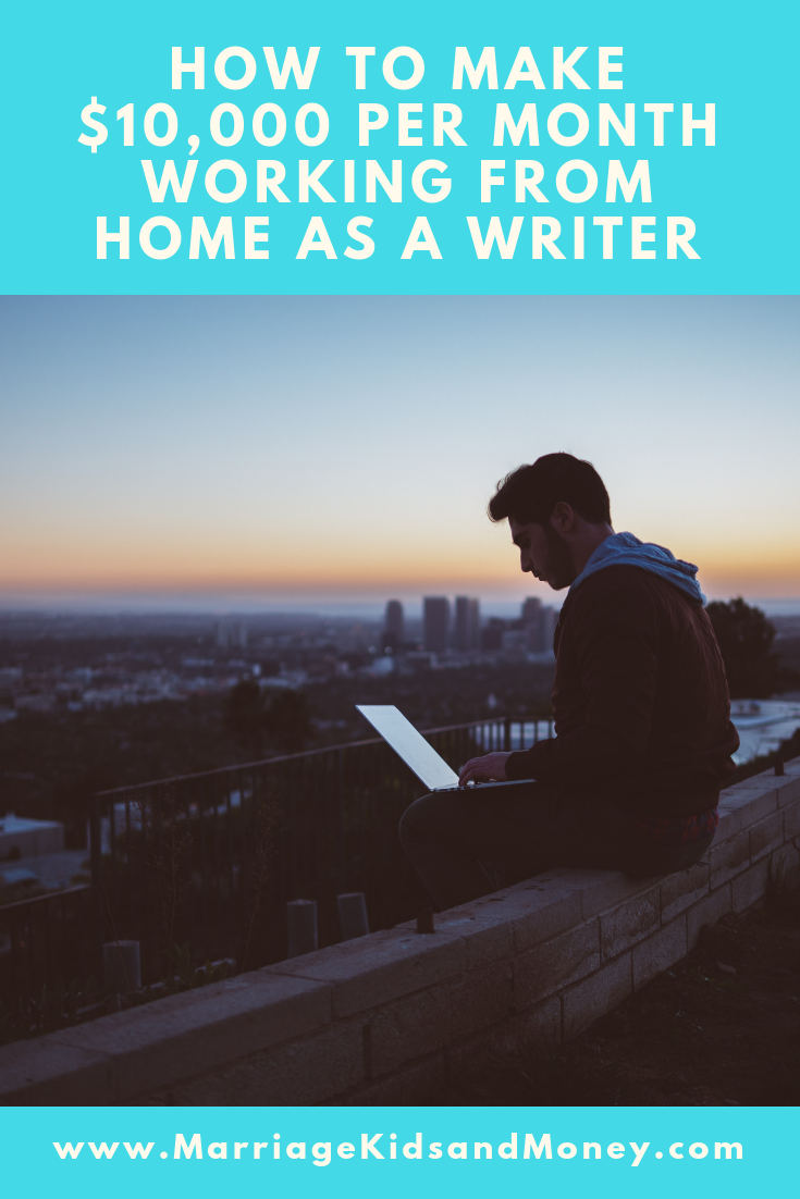 Man writing on computer outside at night