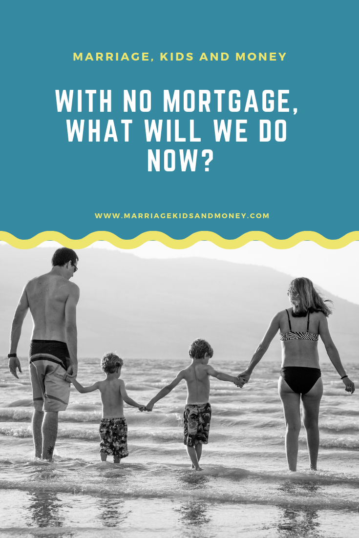 Family holding hands walking by the ocean