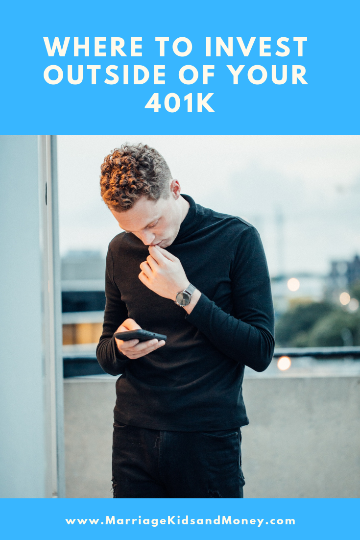 Man looking at phone thinking