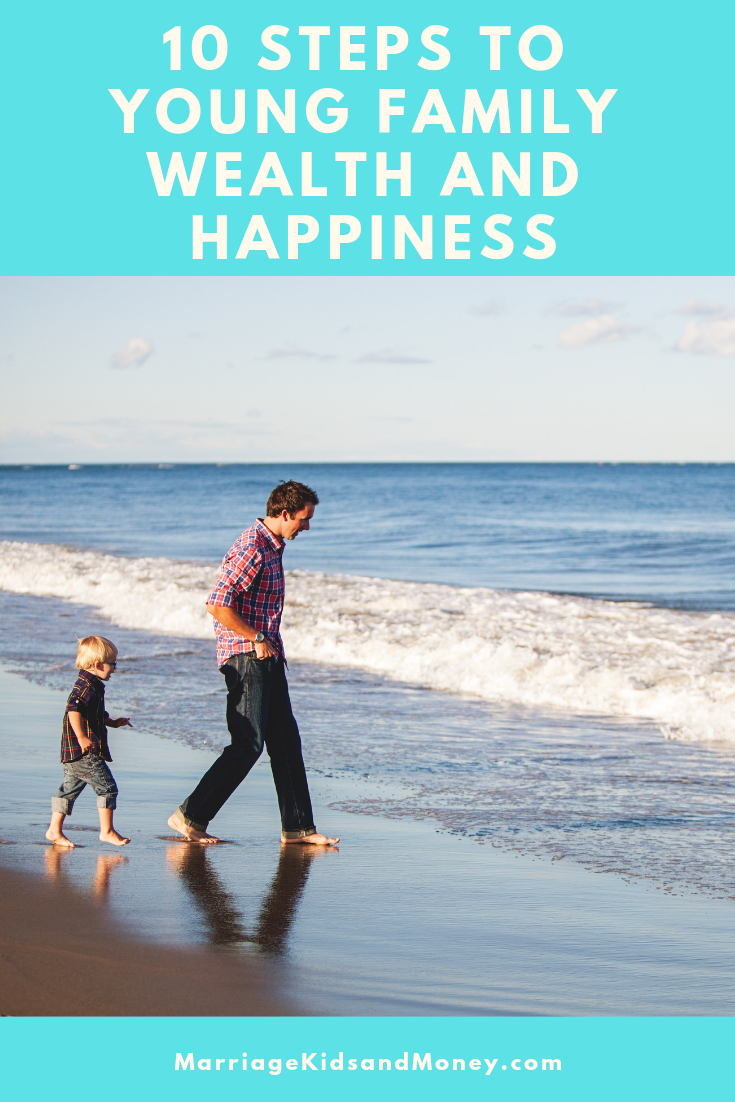Father and son on the beach walking