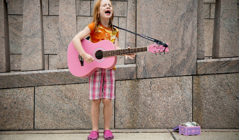 Girl singing for money
