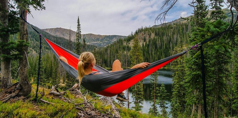 Woman relaxing in a hammock