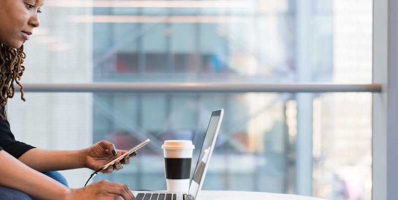 woman typing on laptop