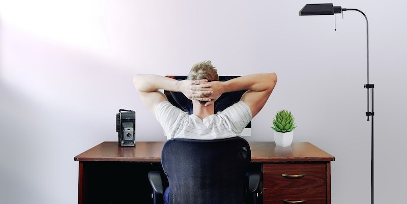 man thinking at computer