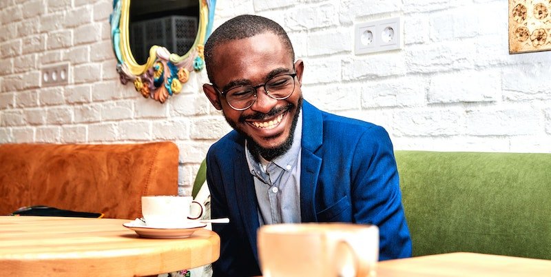 smiling man in coffee shop
