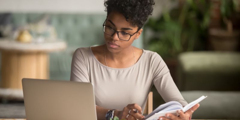 Woman looking at laptop