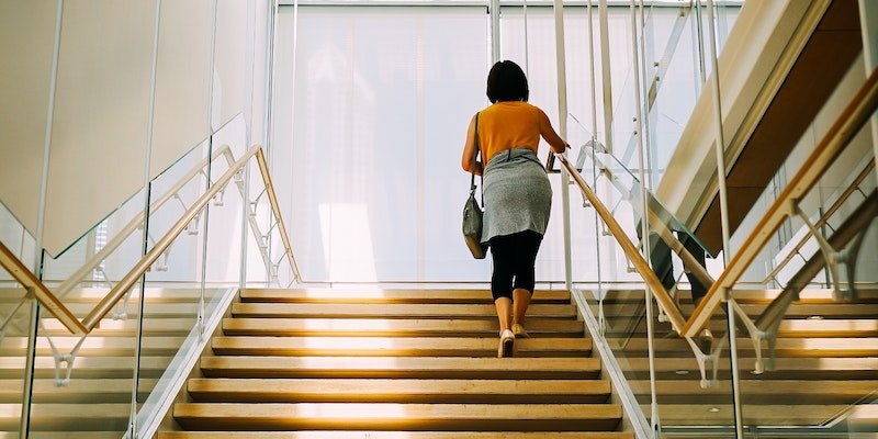 Woman walking up steps