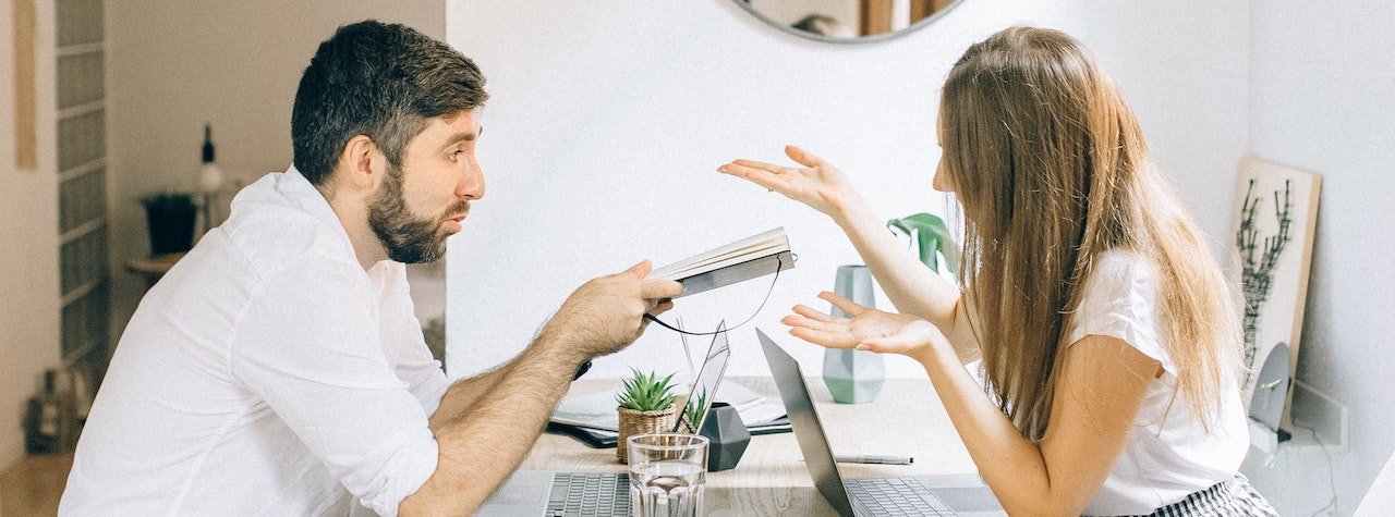 Couple talking at dinner table