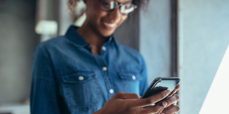 woman holding cell phone