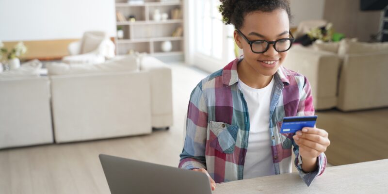 teen with debit card