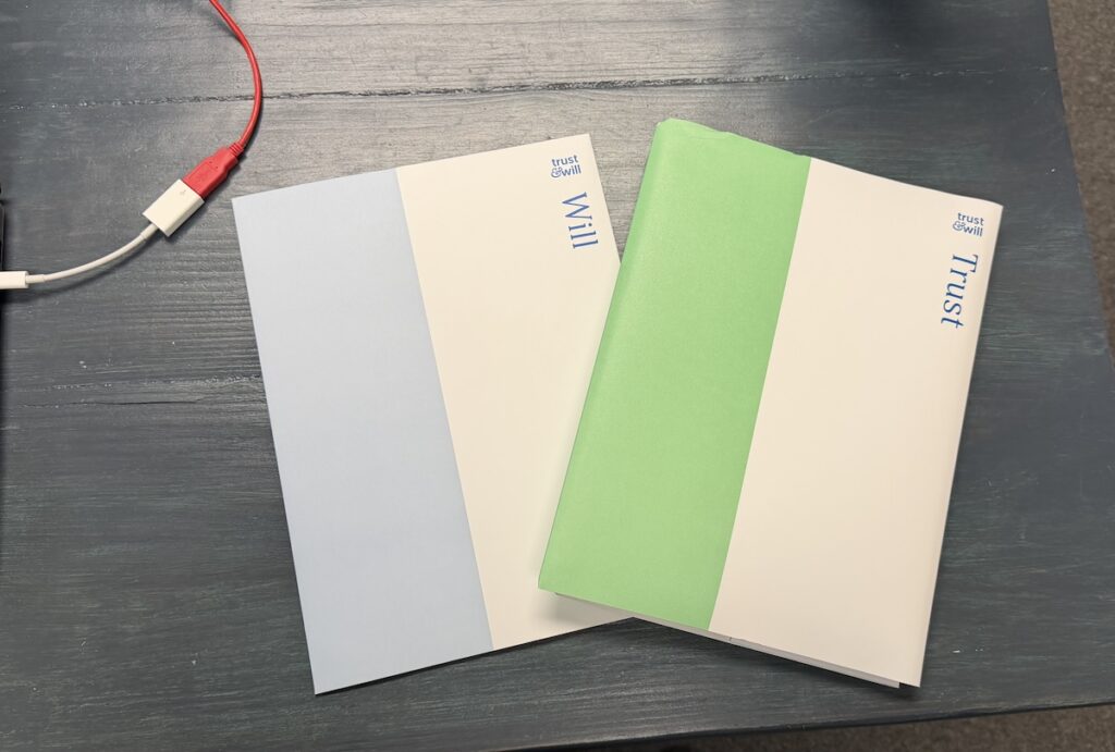 Trust & Will folders containing completed estate planning documents, including a will and revocable living trust.