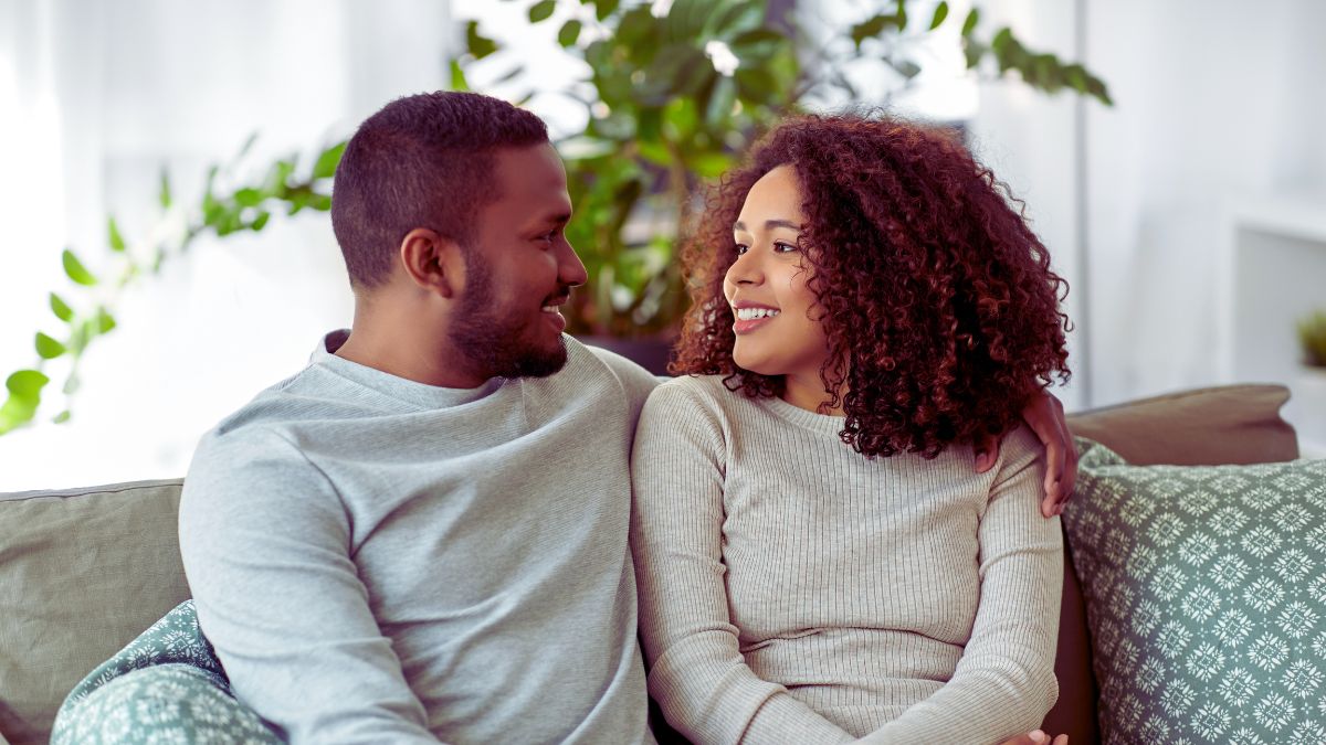 couple talking on couch
