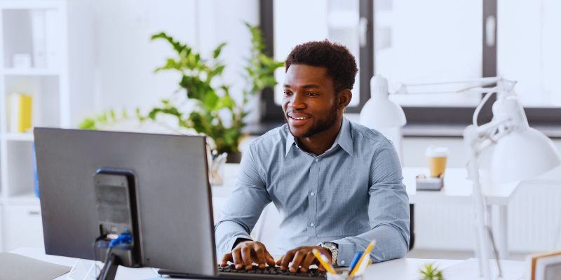 man looking on computer