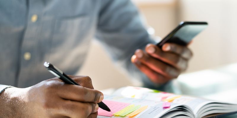 man budgeting on his phone