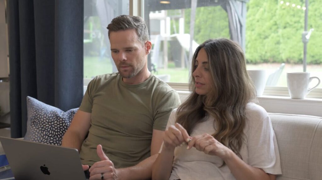 Andy and Nicole Hill reviewing their family finances together on a laptop during a biweekly money date using Monarch Money.